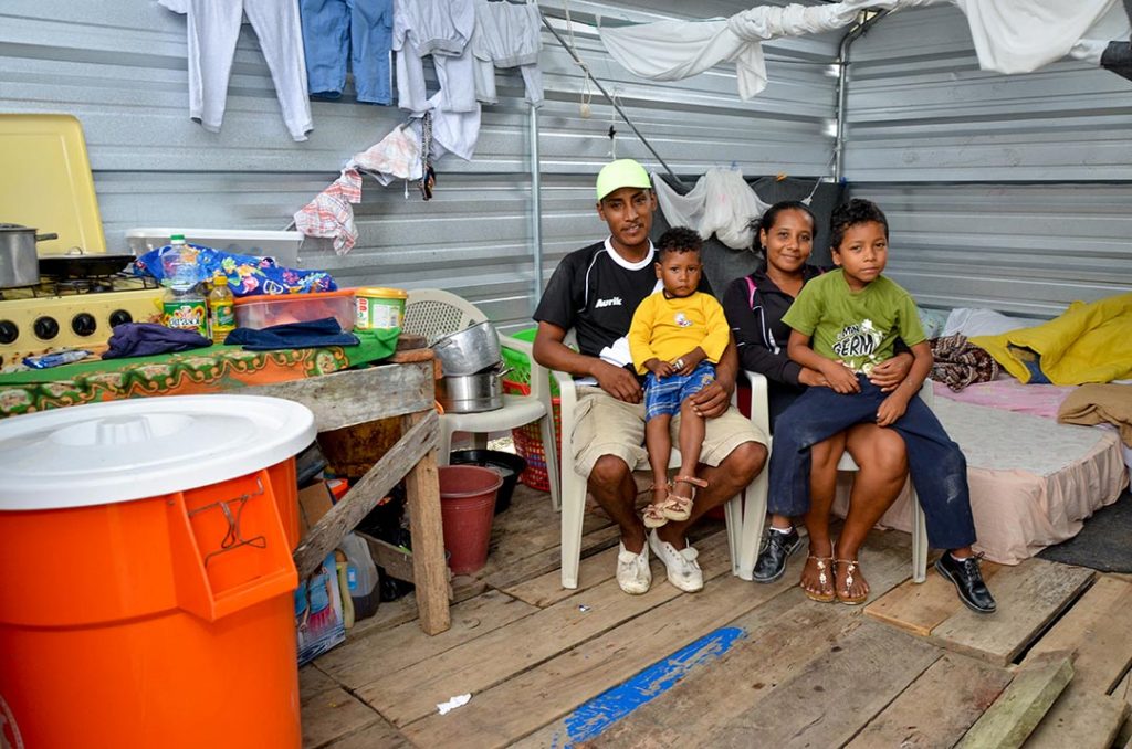 Dastin and his family in their new home