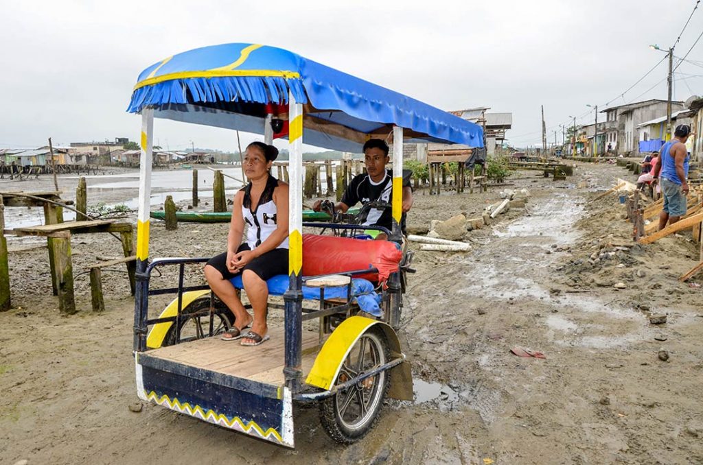 Dastin’s dad, Miguel, at work transporting people on his moto-tricycle.