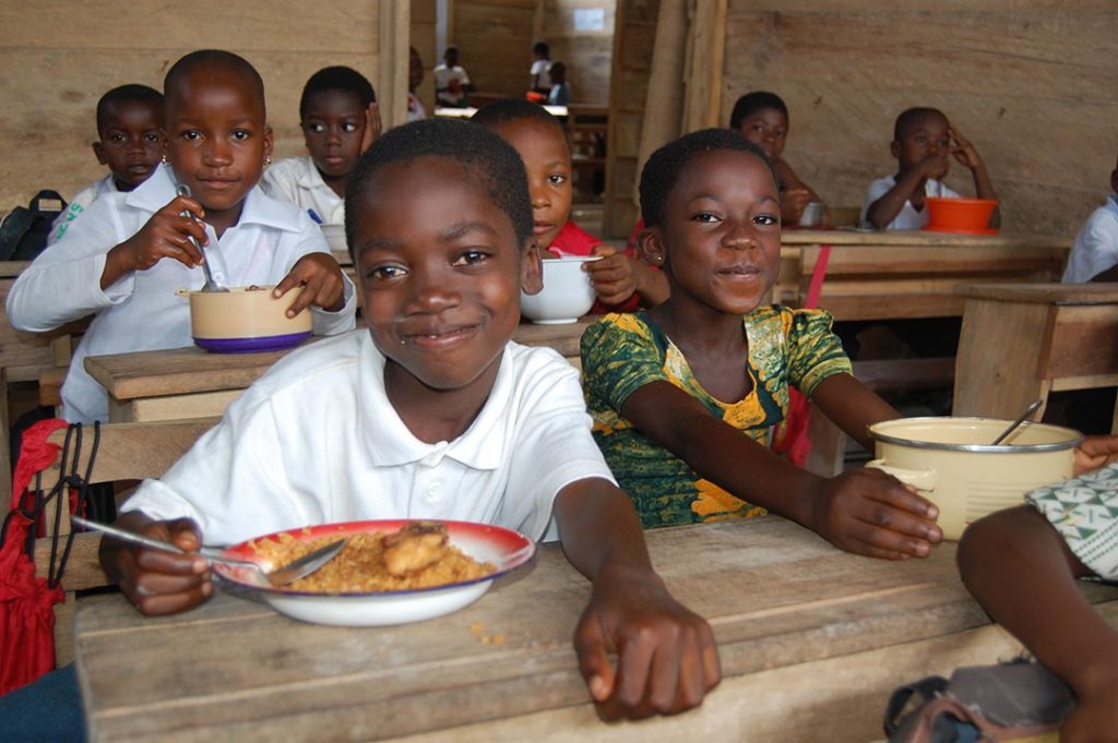 Children eat a meal at Compassion centre