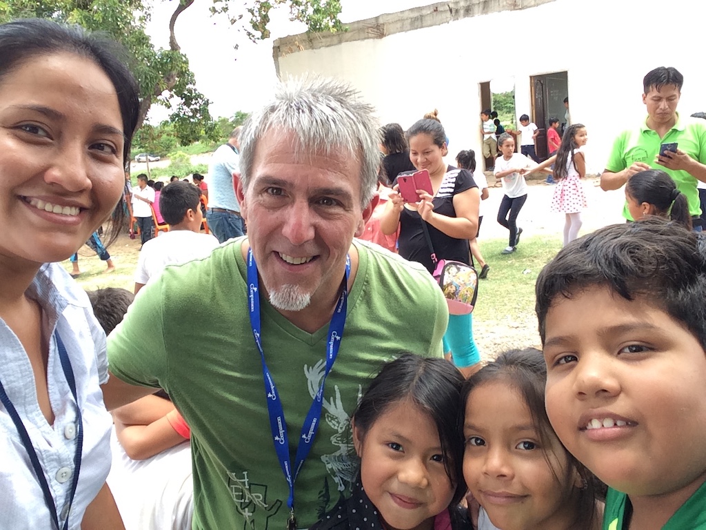 Pastor Brad with a group of children and a Compassion staff member in Bolivia.